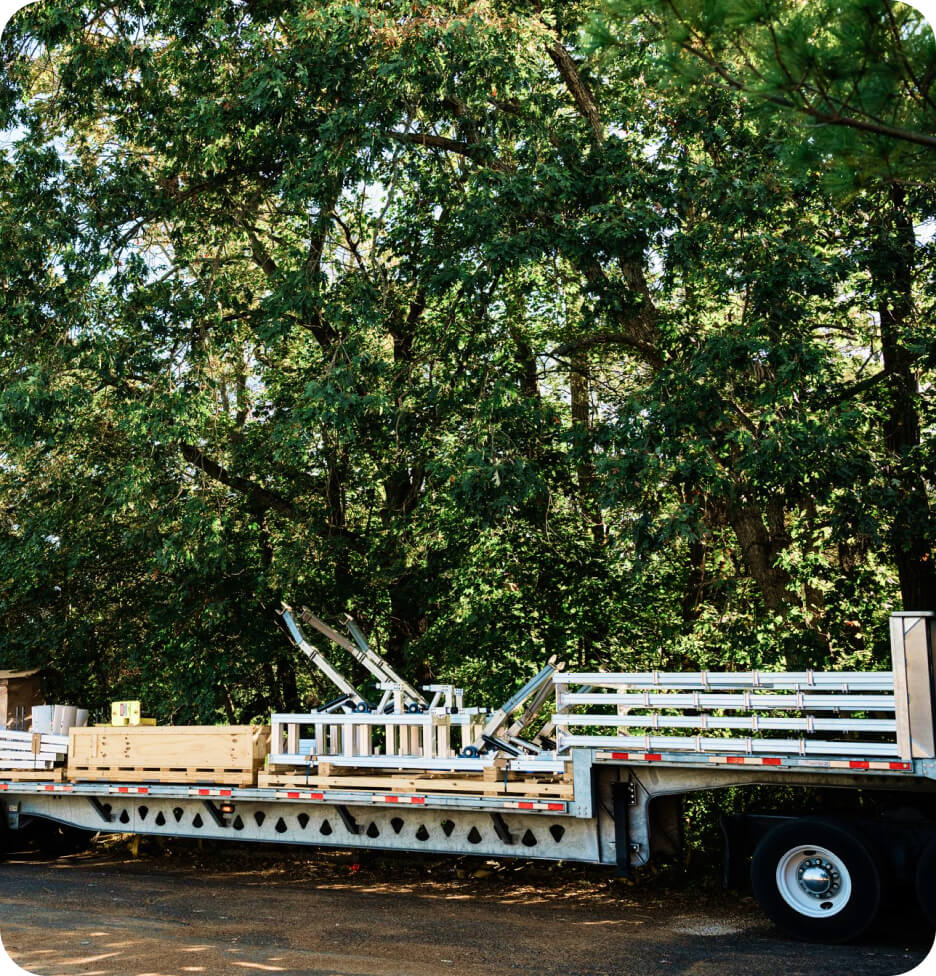 Specialized car-wash equipment staged on a flatbed trailer ahead of sequenced delivery