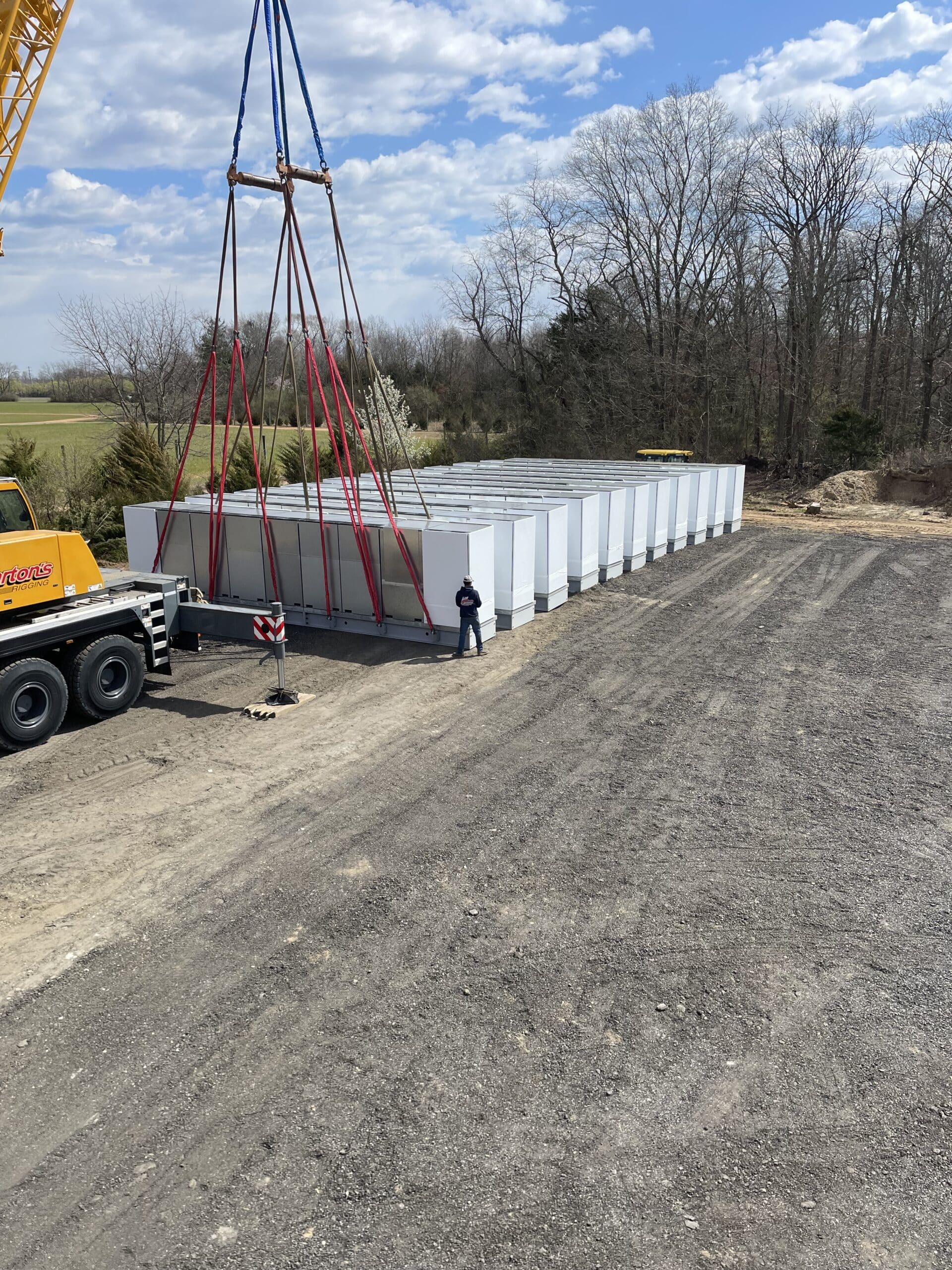 Crane staging precast units in the outdoor yard