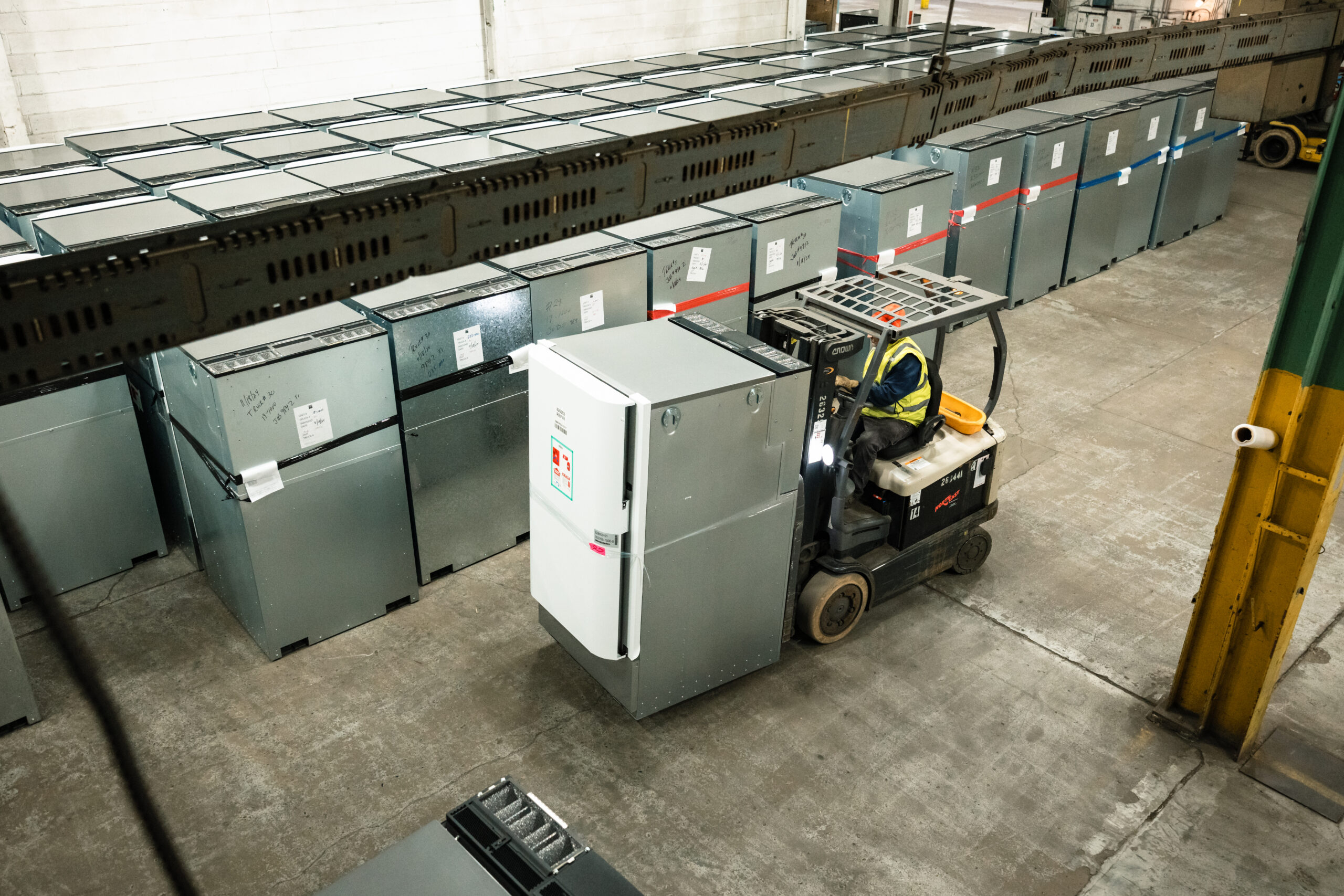 Forklift moving switchgear at the Vineland warehouse